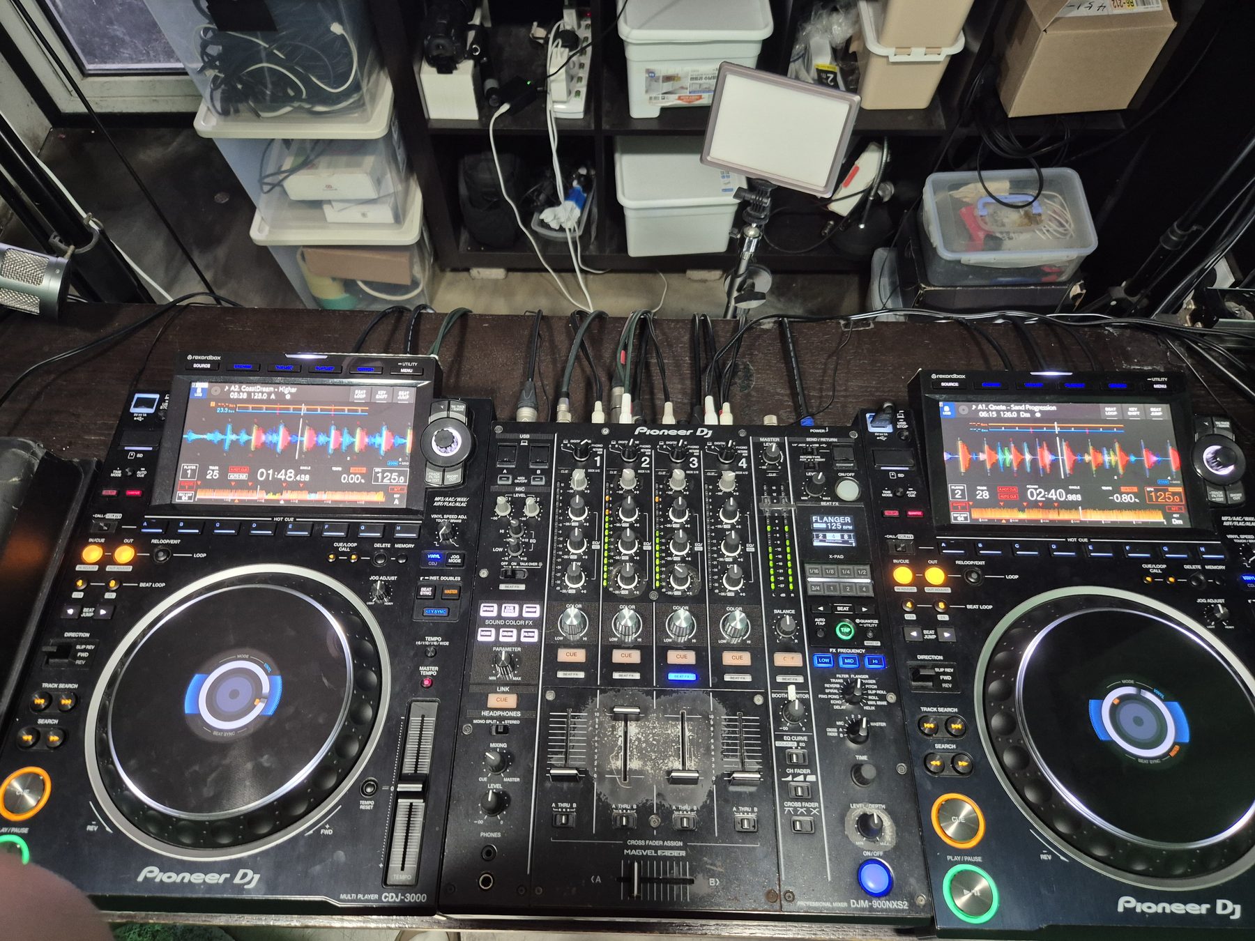 The same home practice setup a moment later, two Pioneer CDJ players and a DJM mixer.